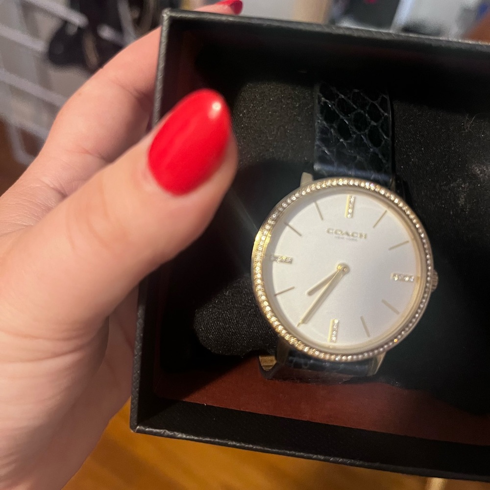 beautiful Coach watch w/ defects please see pictures (strap needs repaired)